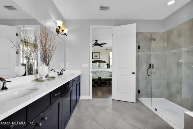 a kitchen with a stove and a potted plant