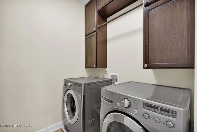a living room filled with furniture and a floor to ceiling window