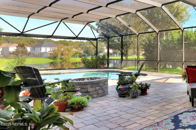 a view of a swimming pool with a patio