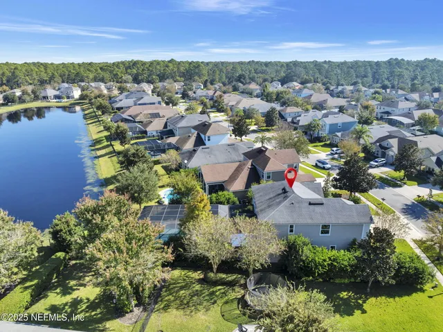 a view of a swimming pool and lounge chairs