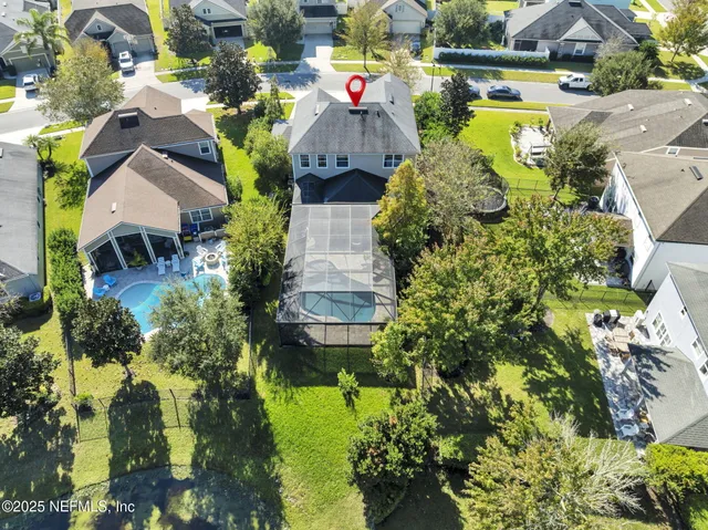 a view of a patio with a table chairs and a backyard