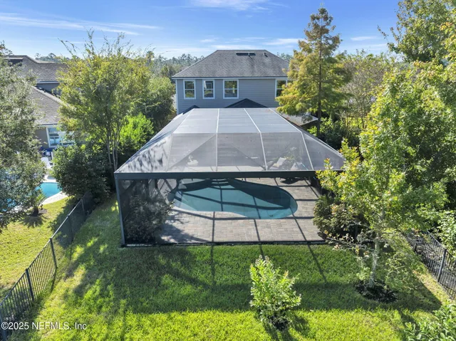 a view of a field with an ocean in the background