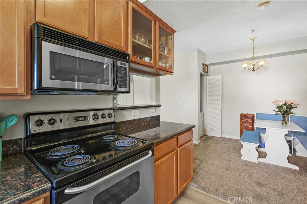 375 Central Avenue, Unit 78 Riverside, CA 92507 - Photo 15 of 43 a kitchen with a stove and a microwave