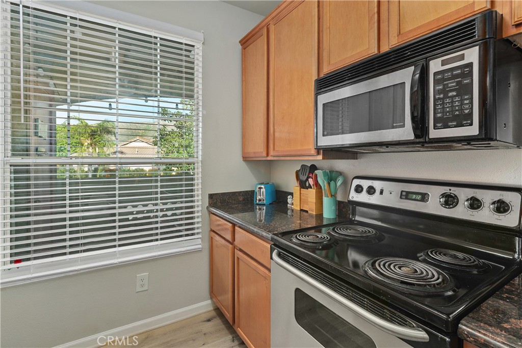 375 Central Avenue, Unit 78 Riverside, CA 92507 - Photo 16 of 43 a kitchen with a stove and a microwave