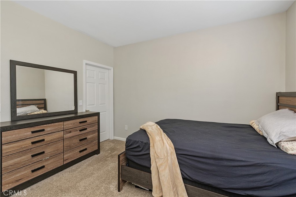 375 Central Avenue, Unit 78 Riverside, CA 92507 - Photo 20 of 43 a view of bedroom with furniture and wooden floor