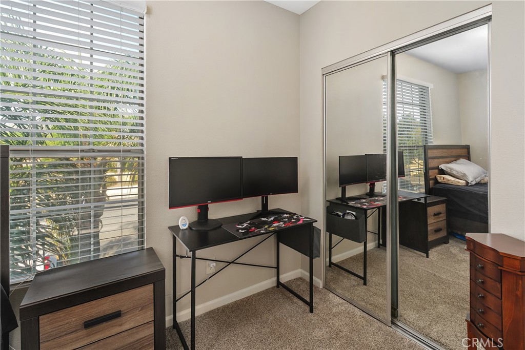 375 Central Avenue, Unit 78 Riverside, CA 92507 - Photo 22 of 43 a living room with furniture and a flat screen tv