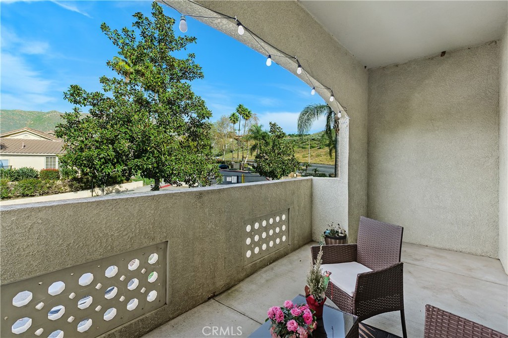 375 Central Avenue, Unit 78 Riverside, CA 92507 - Photo 29 of 43 a view of a chairs and table in a balcony