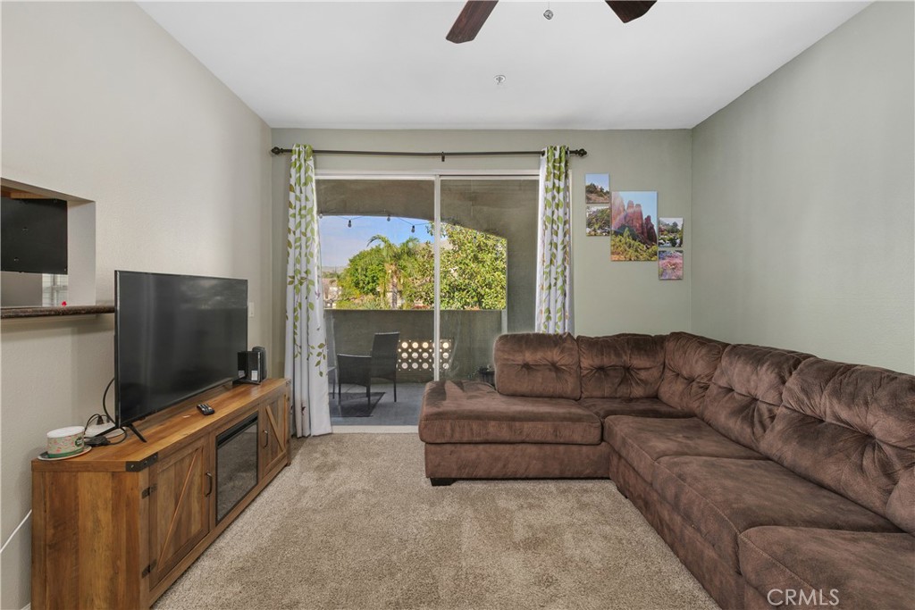 375 Central Avenue, Unit 78 Riverside, CA 92507 - Photo 4 of 43 a living room with furniture and a flat screen tv