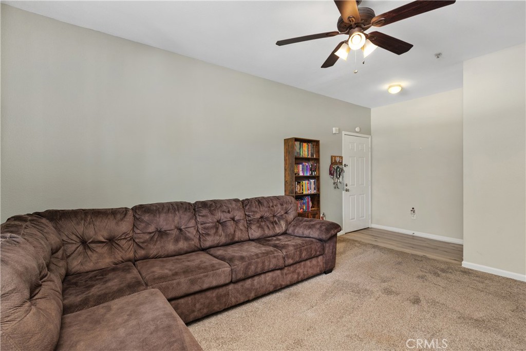 375 Central Avenue, Unit 78 Riverside, CA 92507 - Photo 5 of 43 a living room with furniture and a ceiling fan