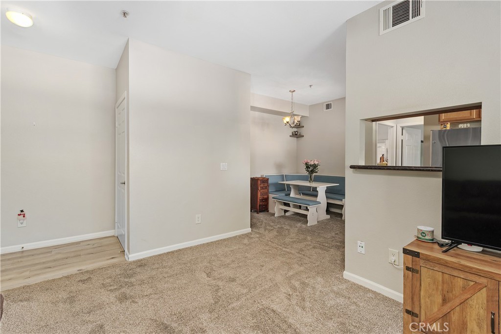 375 Central Avenue, Unit 78 Riverside, CA 92507 - Photo 7 of 43 a room with furniture and a flat screen tv