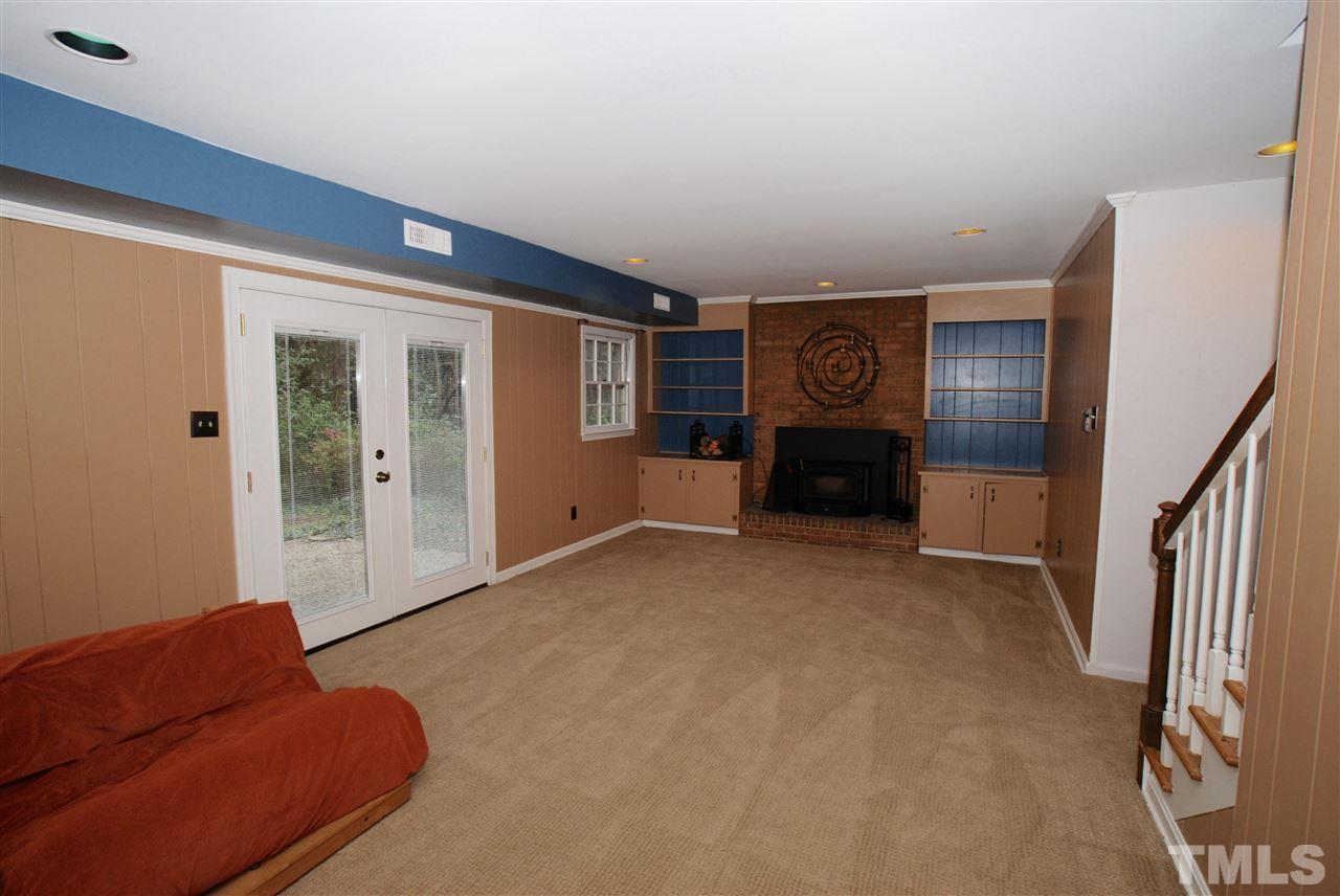 3306 Mesa Court Raleigh, NC 27607 - Photo 13 of 25 a living room with furniture and a ceiling fan