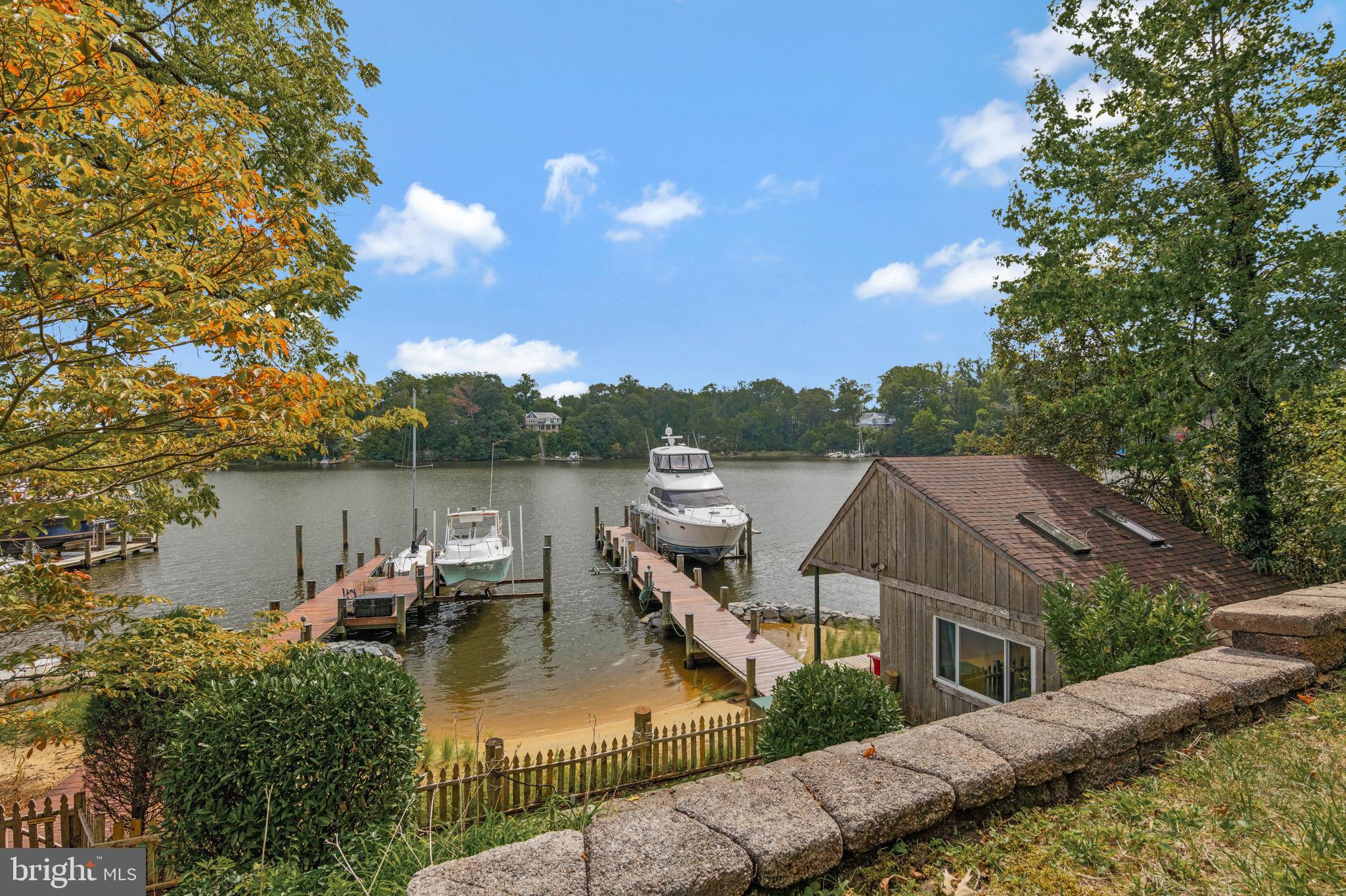 4002 Tudor Hall Road Riva, MD 21140 - Photo 1 of 75 a view of a lake in middle of the house