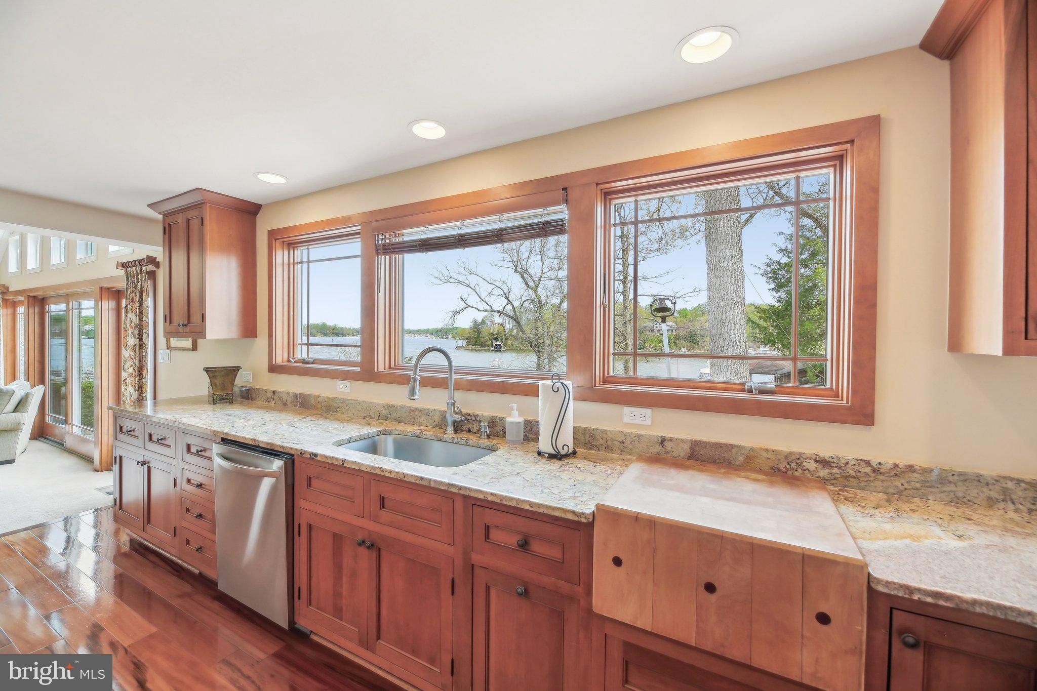 4002 Tudor Hall Road Riva, MD 21140 - Photo 27 of 75 a kitchen with granite countertop white cabinets and a window