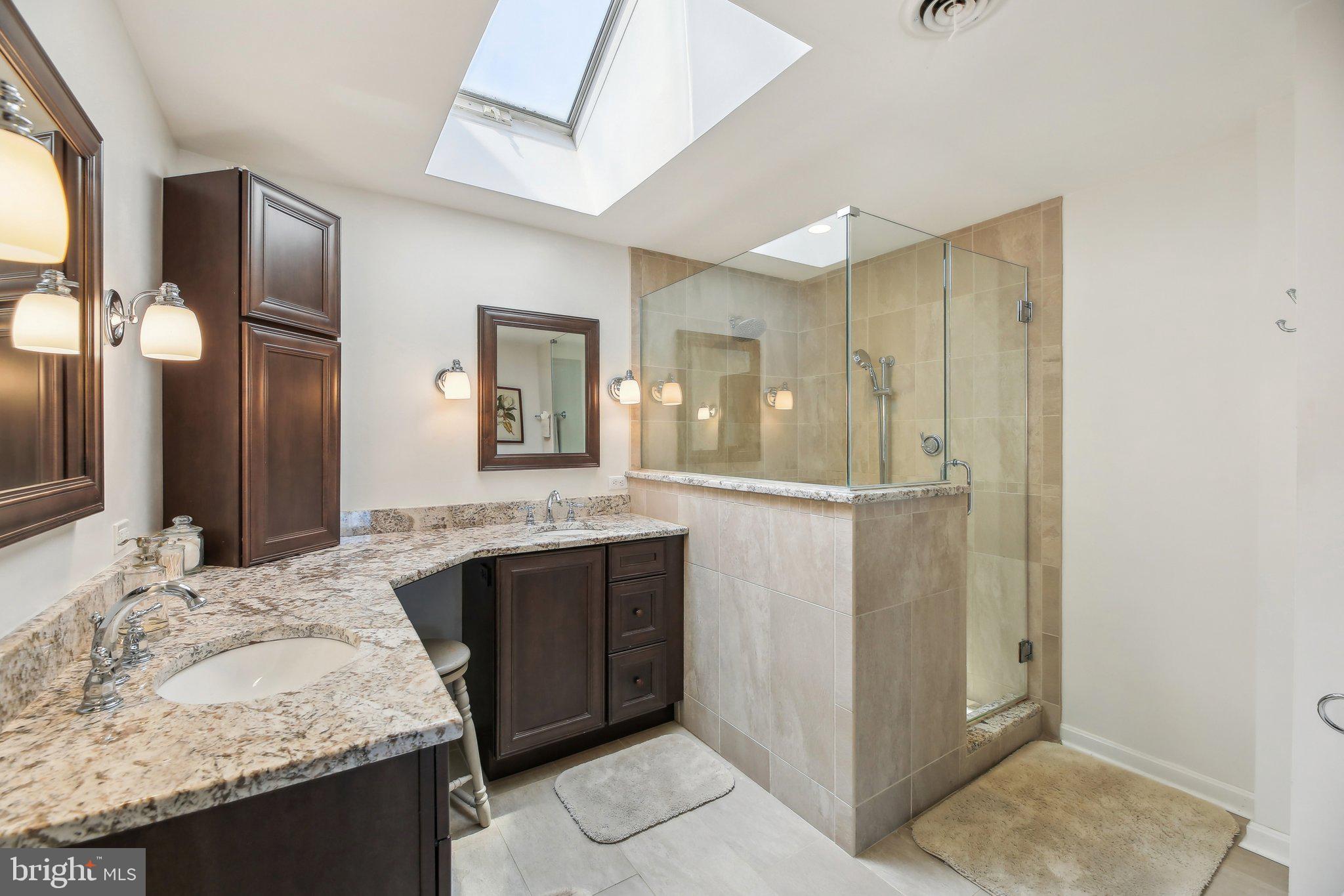 4002 Tudor Hall Road Riva, MD 21140 - Photo 40 of 75 a bathroom with a granite countertop sink and a mirror