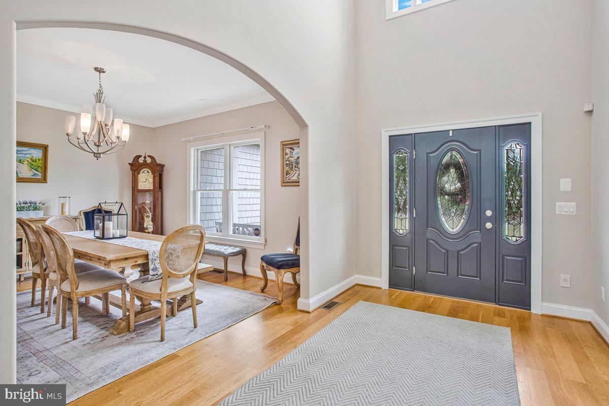 5 Jessie Road Harwood, MD 20776 - Photo 18 of 87 a living room with furniture a chandelier and a dining table