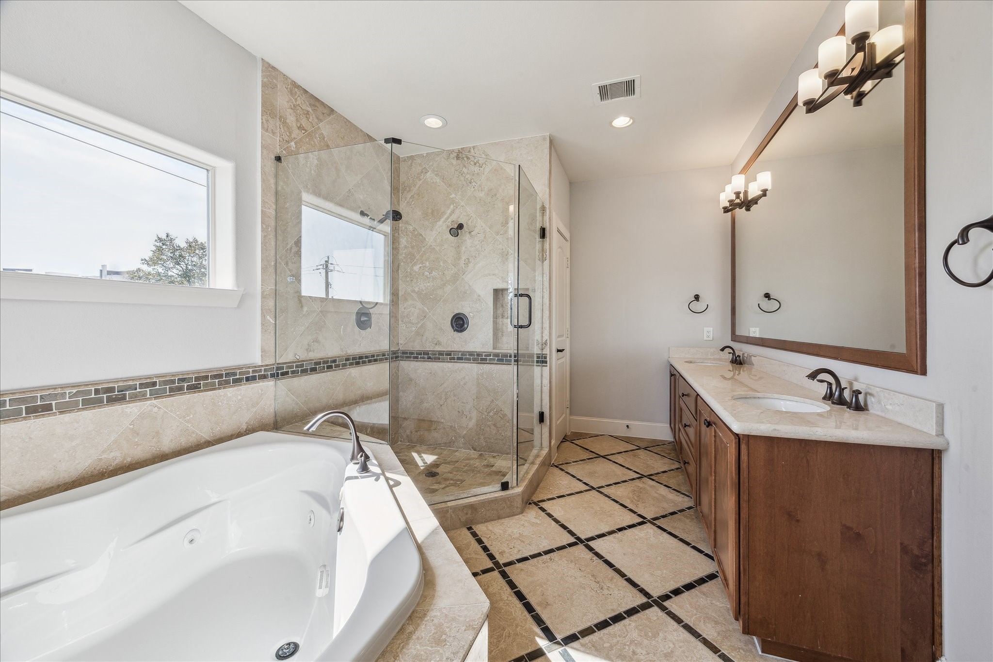 303 Bethje Street Houston, TX 77007 - Photo 13 of 25 a bathroom with a tub sink and mirror