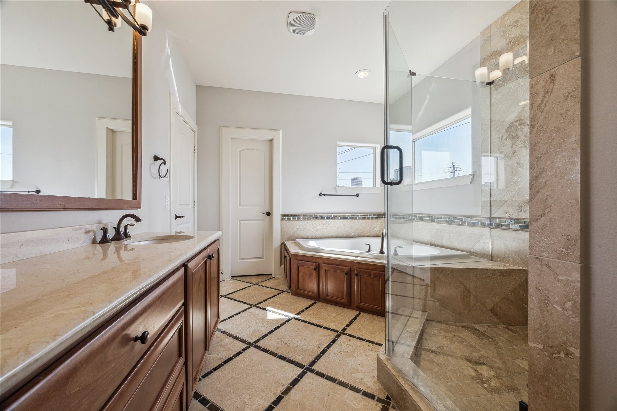 303 Bethje Street Houston, TX 77007 - Photo 14 of 25 a bathroom with a sink and a mirror