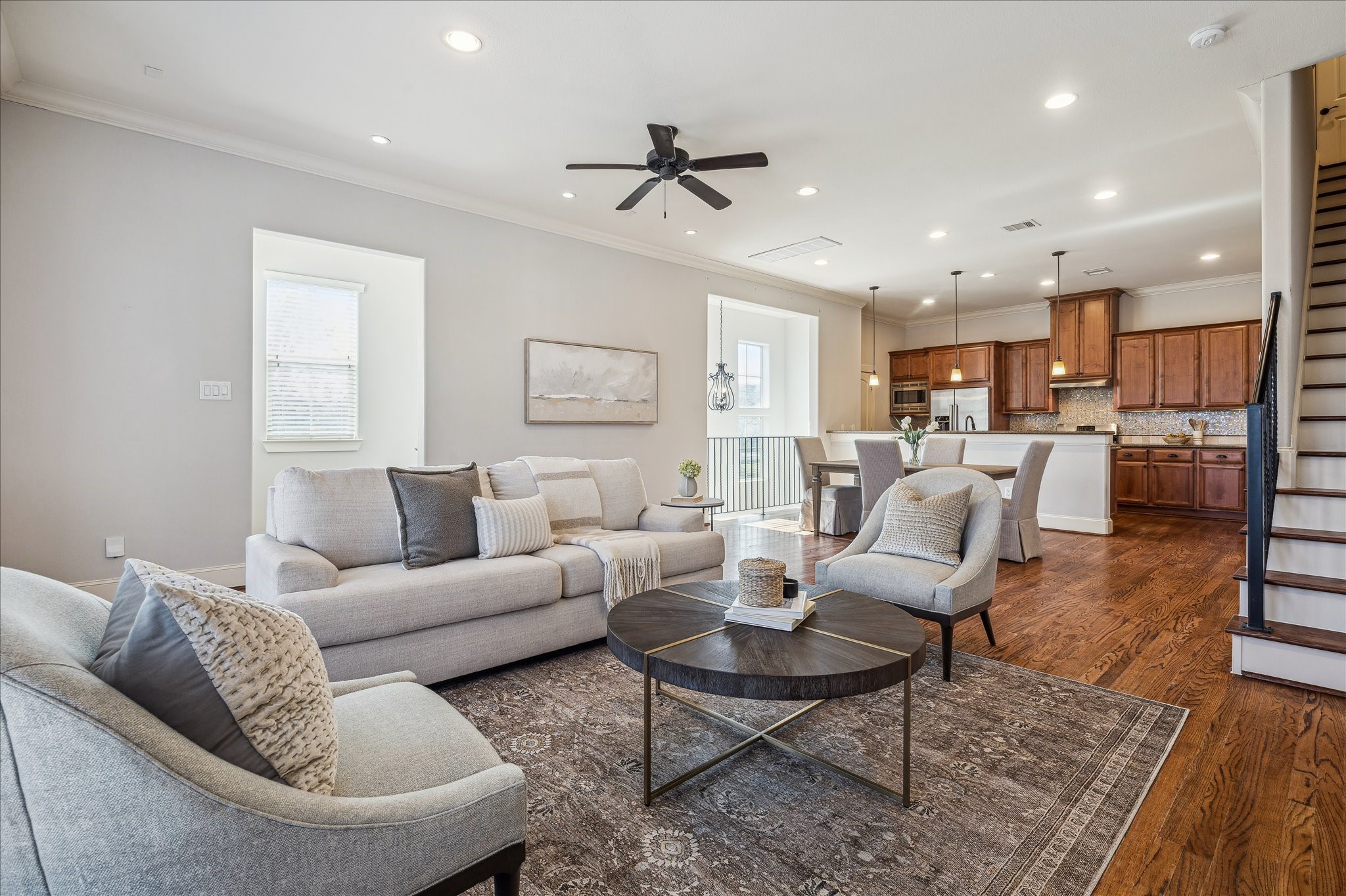303 Bethje Street Houston, TX 77007 - Photo 3 of 25 a living room with furniture kitchen view and a wooden floor