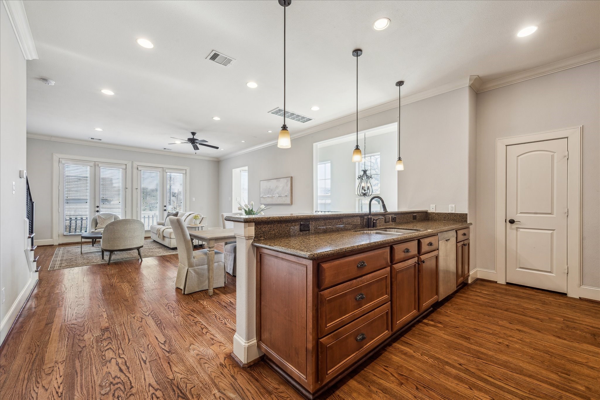 303 Bethje Street Houston, TX 77007 - Photo 6 of 25 a kitchen with stainless steel appliances granite countertop a stove and a wooden floors