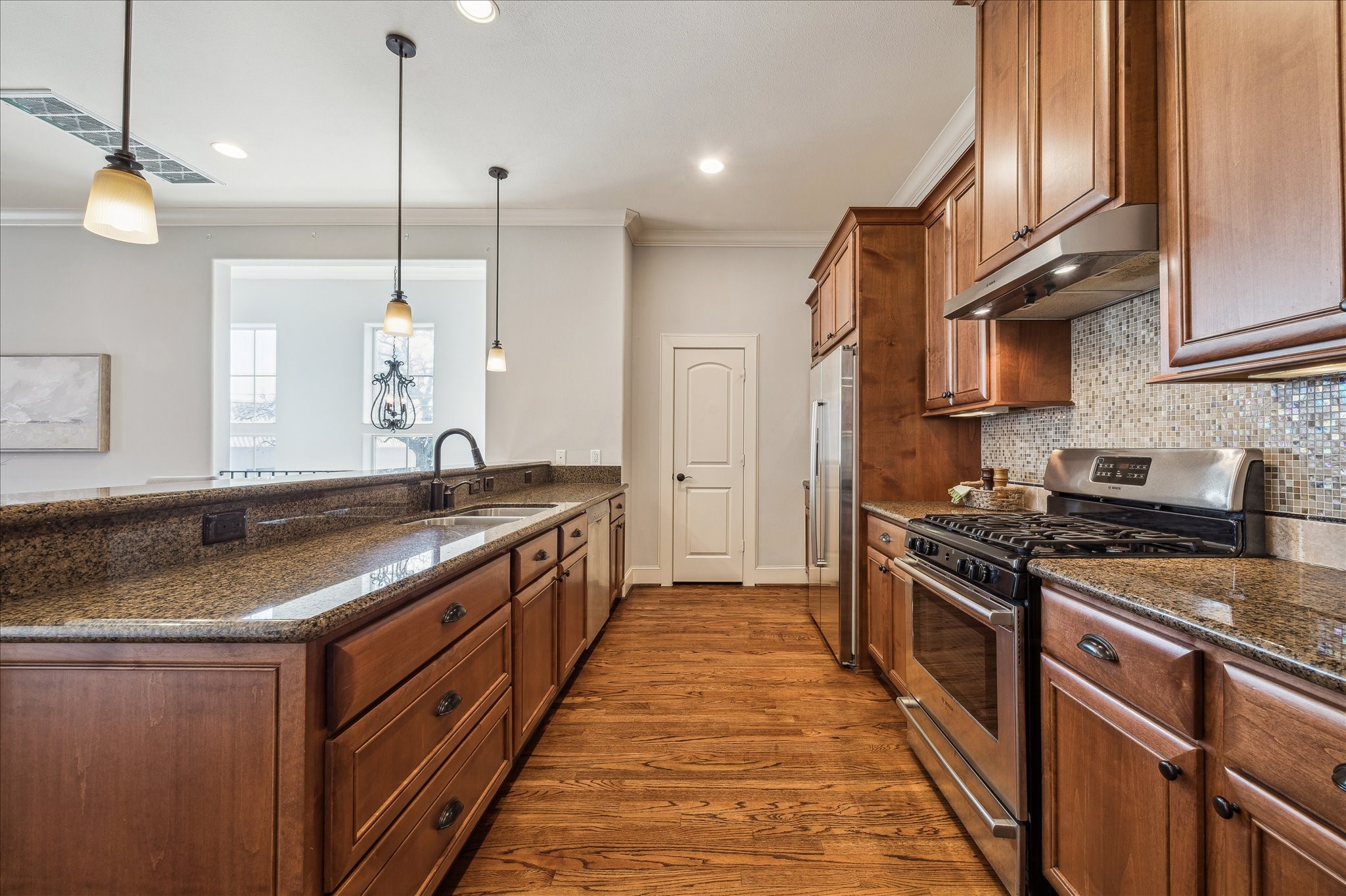 303 Bethje Street Houston, TX 77007 - Photo 8 of 25 a kitchen with stainless steel appliances granite countertop a stove a sink and a refrigerator