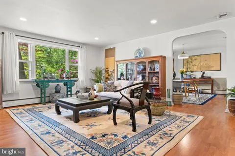 a living room with furniture and a rug