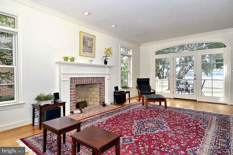710 South River Landing Road, Unit 710 Edgewater, MD 21037 - Photo 14 of 30 Living Room with Fireplace Opening to Deck