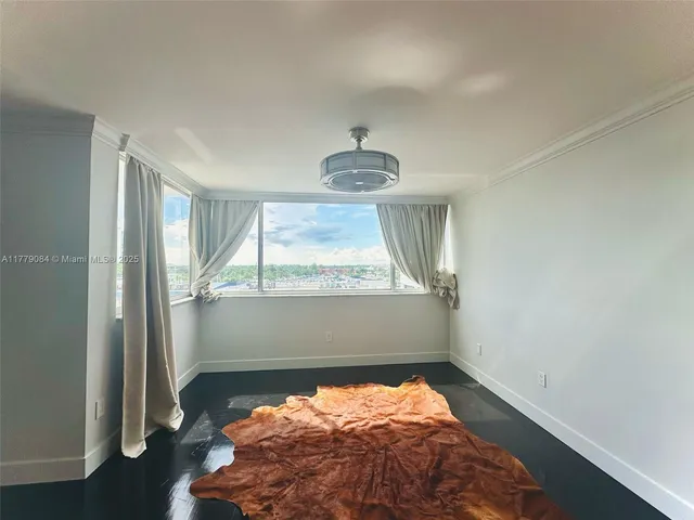 a view of water heater room with wooden floor