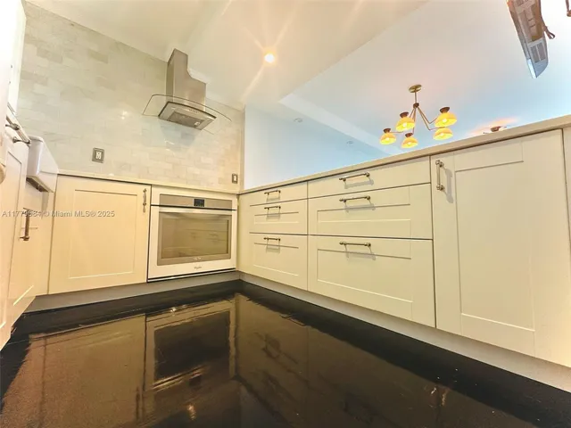 storage and utility room with wooden floor