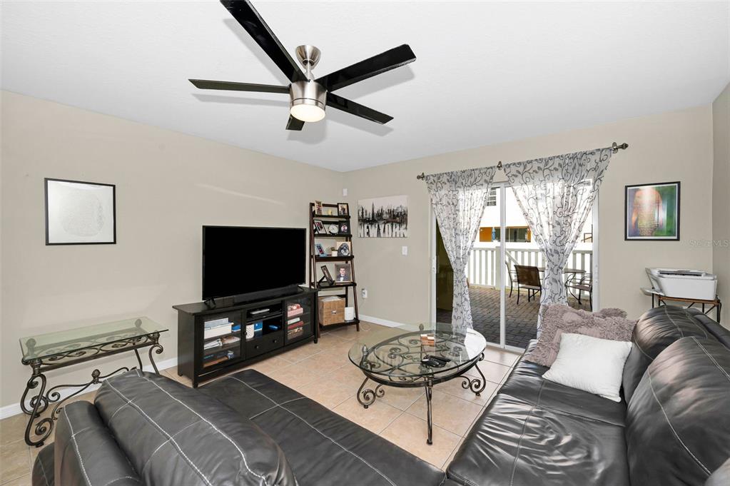 9736 Trumpet Vine Loop Trinity, FL 34655 - Photo 21 of 35 a living room with furniture and a flat screen tv