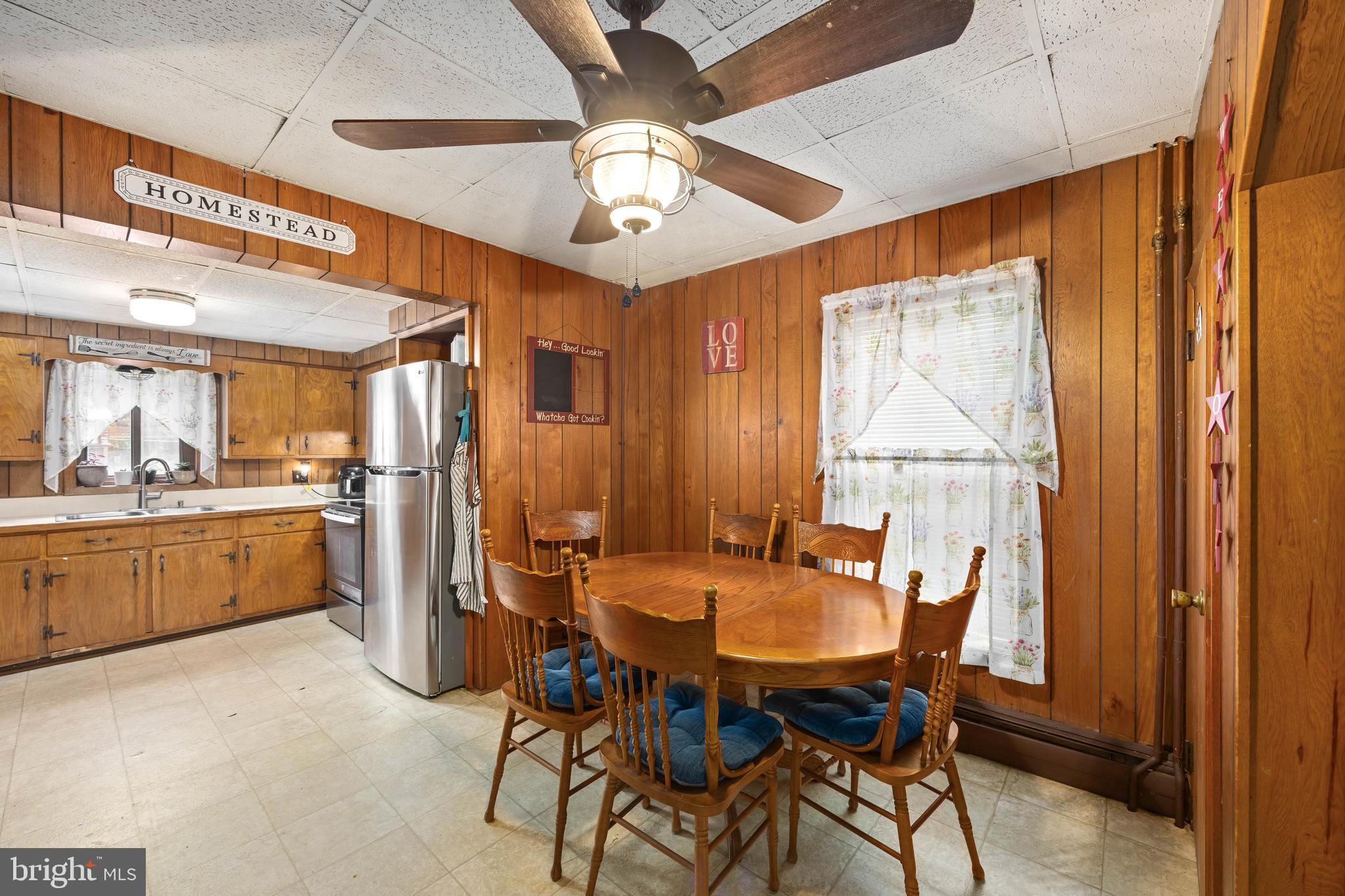 26467 Mariners Road Crisfield, MD 21817 - Photo 18 of 44 a view of a dining room with furniture window and wooden floor