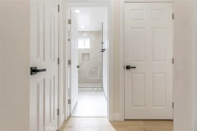 a view of a bathroom from the hallway