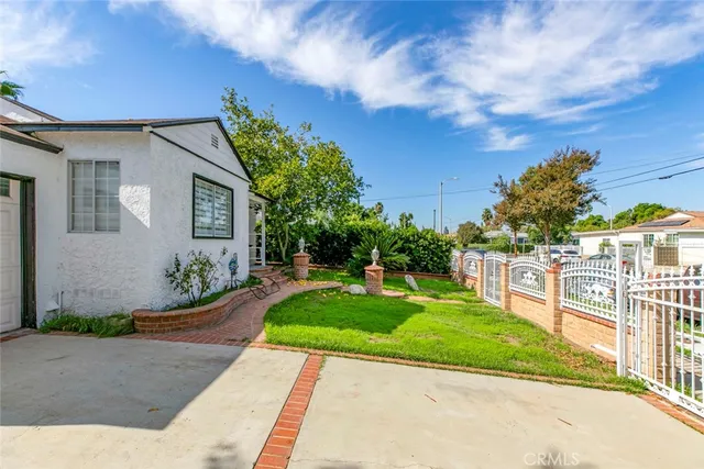 a view of a backyard with a garden and plants