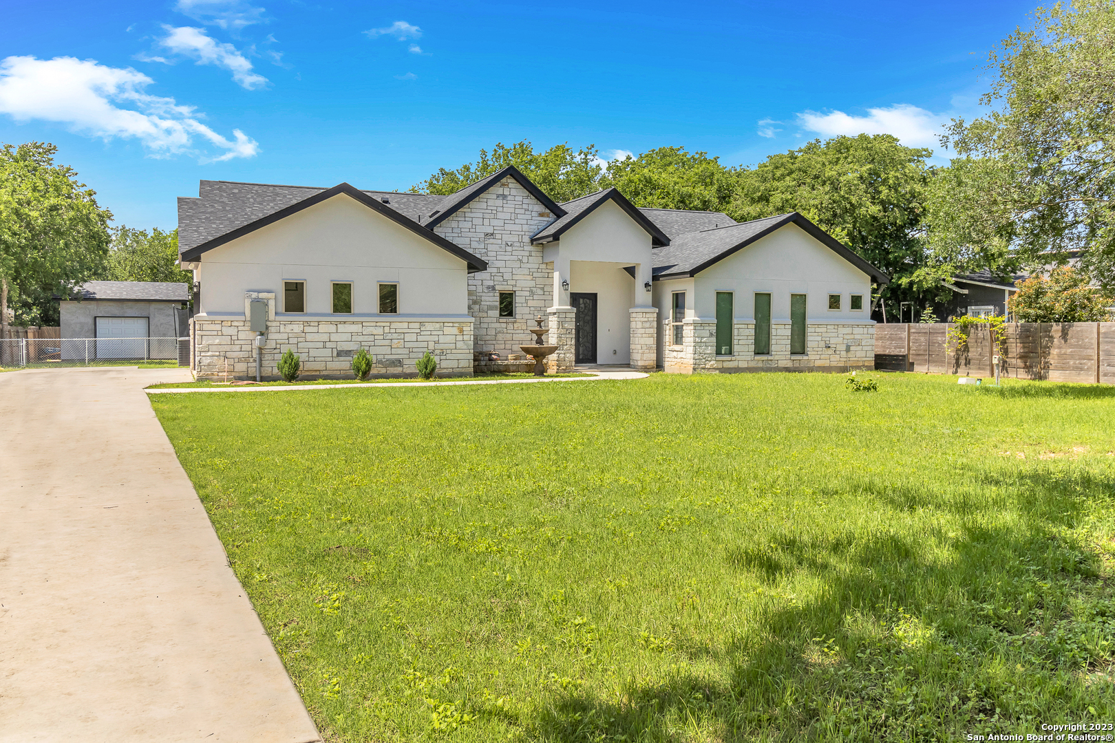 10528 Mountain View San Antonio, TX 78251 - Photo 1 of 1 a view of a house with a big yard and large trees