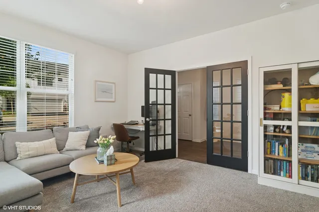a living room with furniture and a window