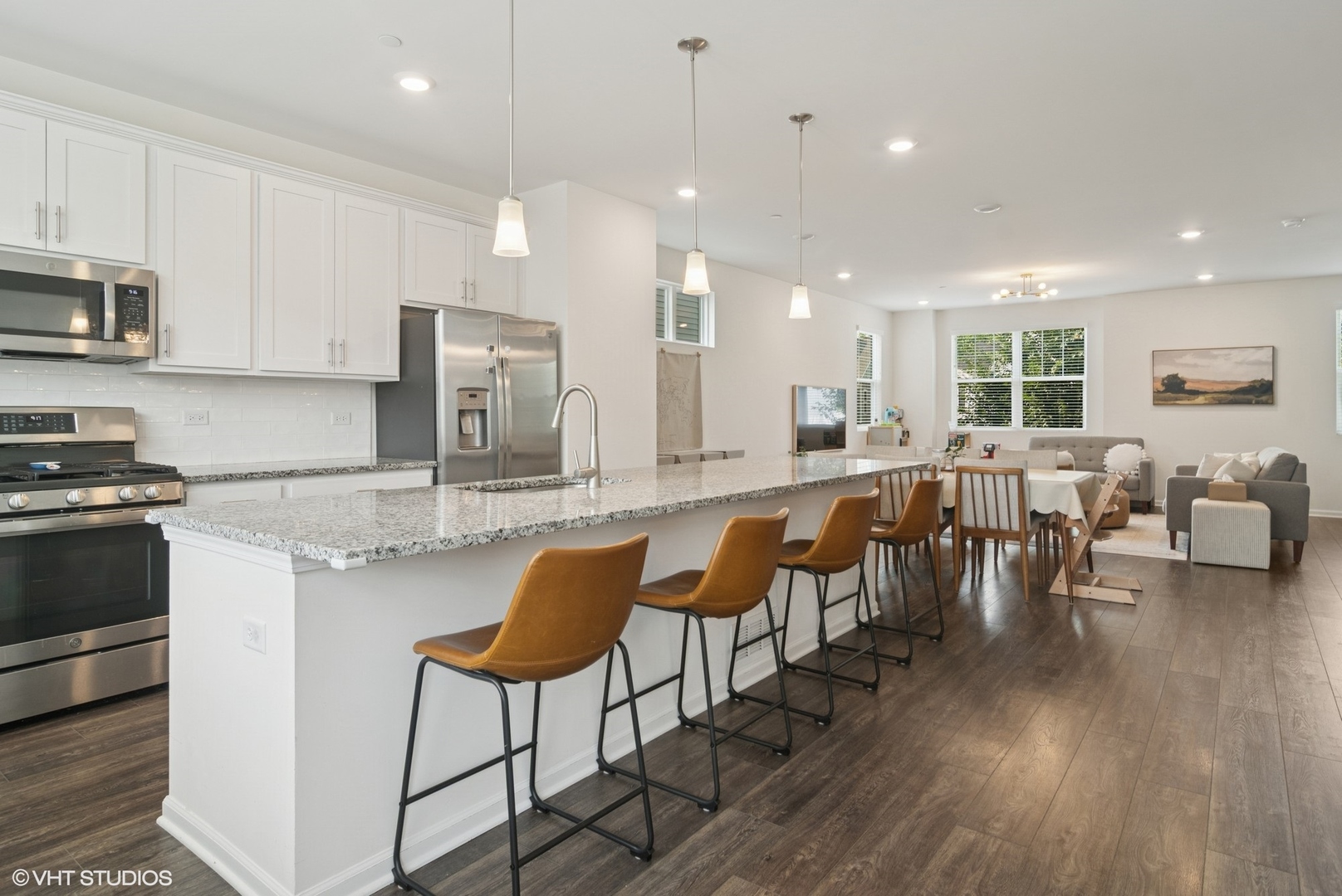 2709 Lily Lane Rolling Meadows, IL 60008 - Photo 9 of 18 a large kitchen with lots of counter space a sink and chairs