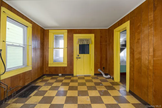 a view of a bathroom with a black and white checkered floor
