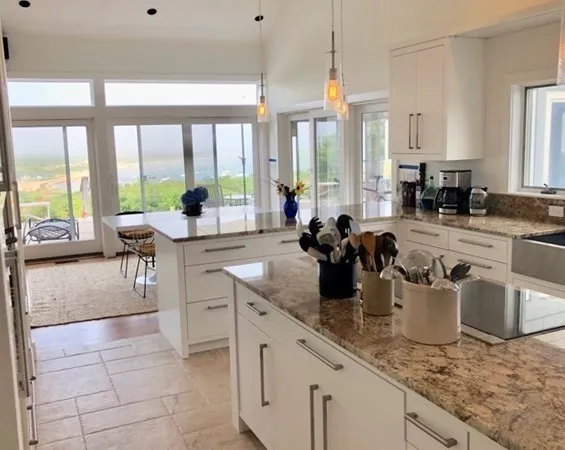 a kitchen with sink a stove and cabinets