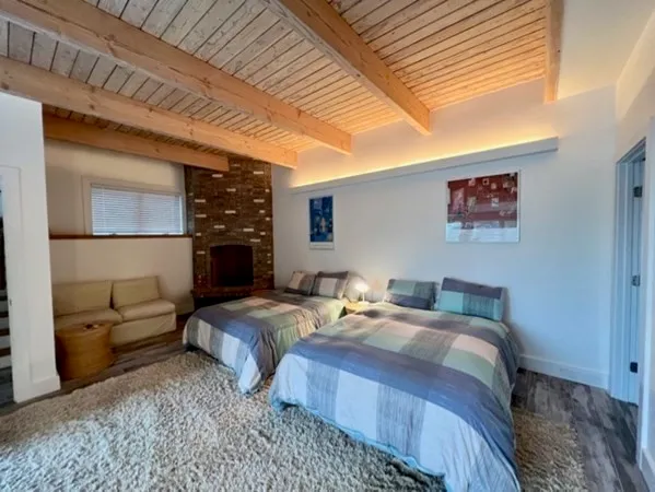 a bedroom with bed and a couch