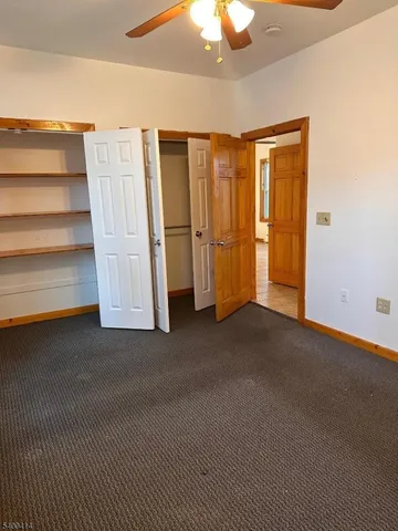 a view of an empty room with a fireplace
