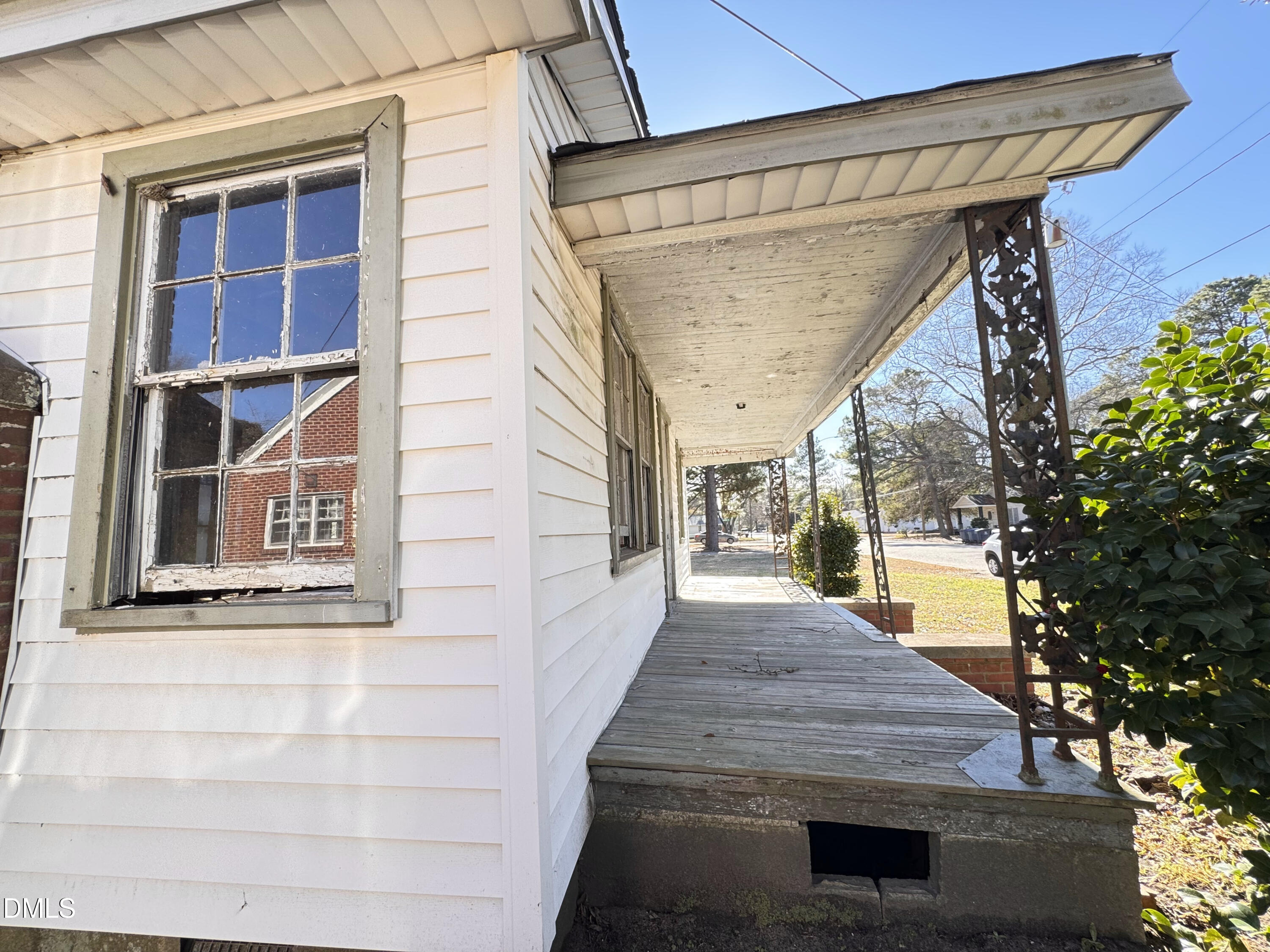 1311 Branch Street Rocky Mount, NC 27801 - Photo 22 of 22 a view of a house with a door and wooden walls