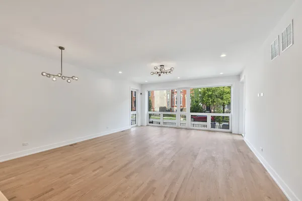 a view of an empty room with a window