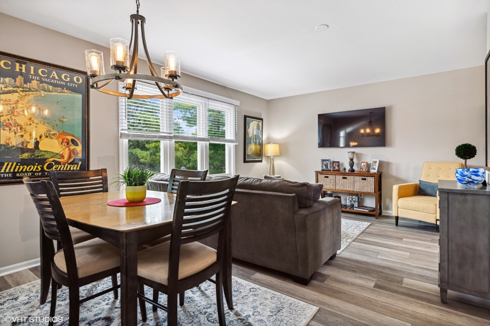 513 Hunters Way Fox River Grove, IL 60021 - Photo 5 of 16 a dining room with wooden floor a chandelier a wooden table and chairs