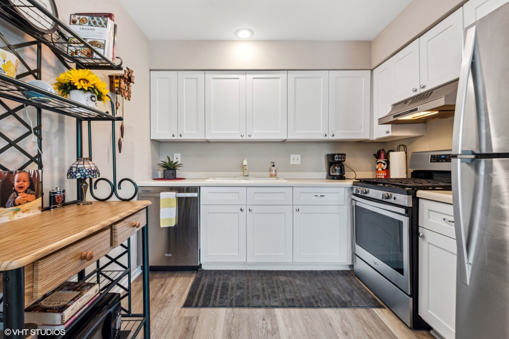 513 Hunters Way Fox River Grove, IL 60021 - Photo 6 of 16 a kitchen with stainless steel appliances a stove a sink and a refrigerator