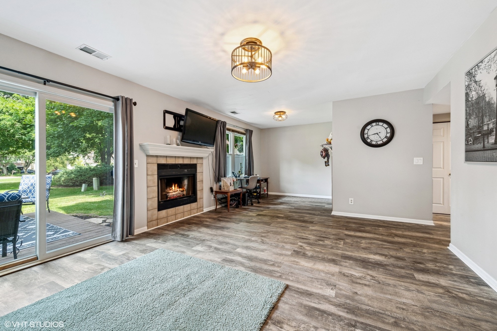 513 Hunters Way Fox River Grove, IL 60021 - Photo 8 of 16 a view of empty room with floor to ceiling window and fireplace