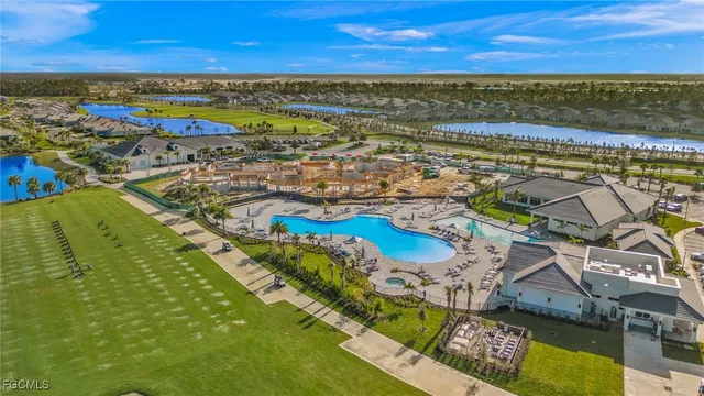 a view of a swimming pool with an outdoor seating