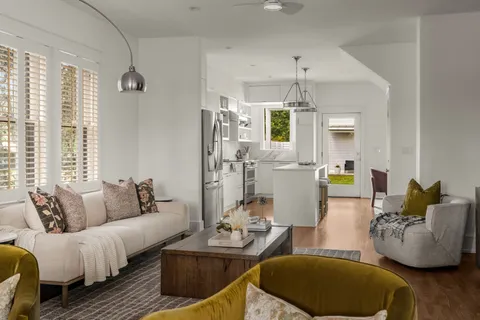 a kitchen with stainless steel appliances granite countertop a sink and a refrigerator