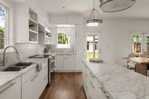 a bedroom with bed and a window