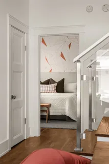 a bathroom with a bathtub sink and mirror