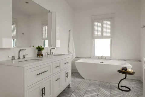 a utility room with sink dryer and washer
