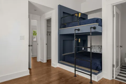 a front view of house with yard outdoor seating and barbeque oven